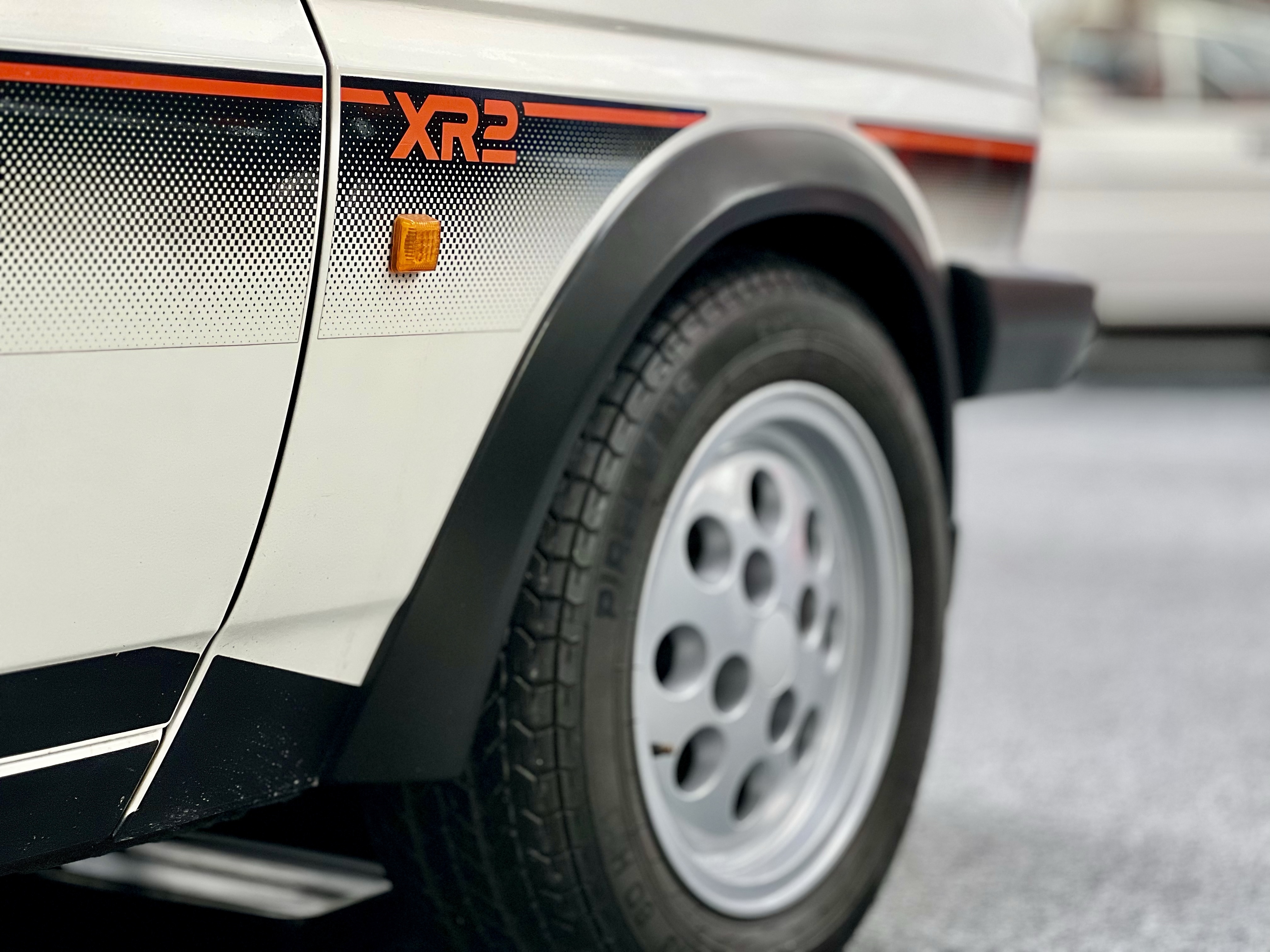 Ford Fiesta XR2 'Pepperpot' alloy wheel and side graphics close-up