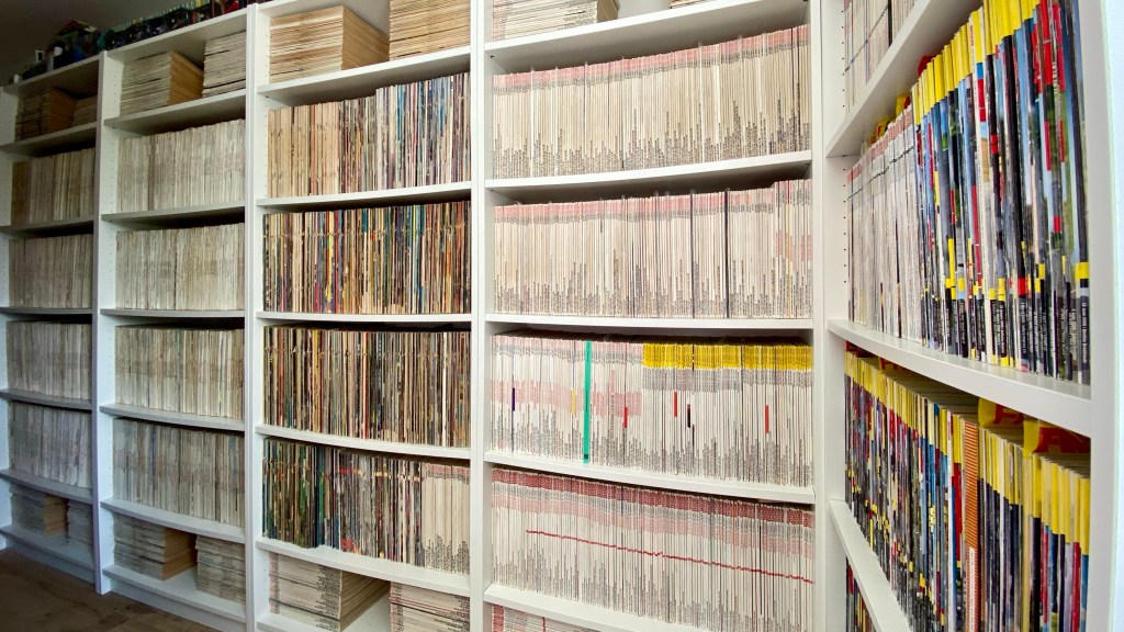 Five of the six bookcases of shelving at The Joy Of Specs archive containing only post-WW2 editions of Autocar magazine