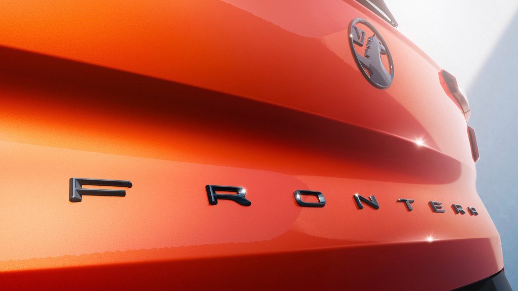 Detail of the tailgate badge on an orange Vauxhall Frontera
