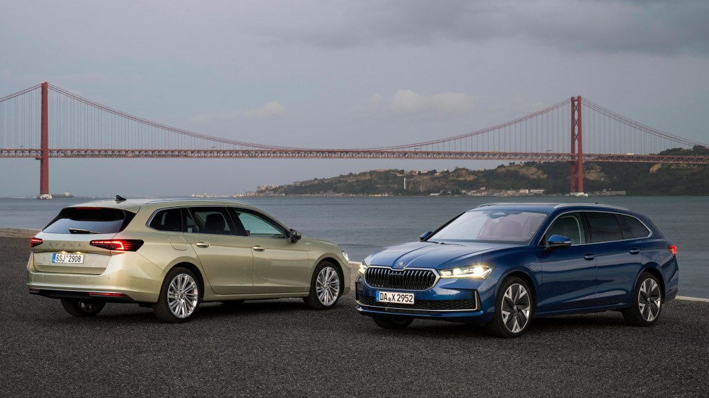 Two Skoda Superb Estates, one green-gold, the other blue, at front and rear three-quarter angles