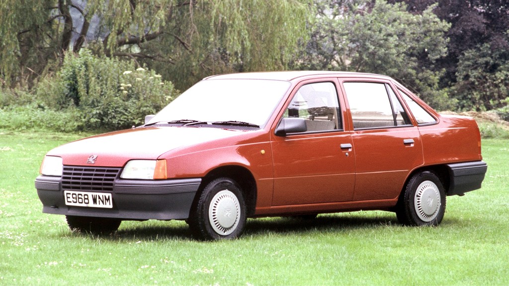 Front three-quarter of a red Vauxhall Belmont Saloon