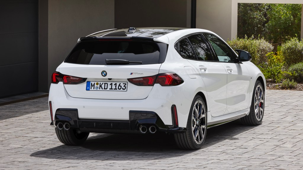 Rear three-quarter of a white BMW M135 xDrive